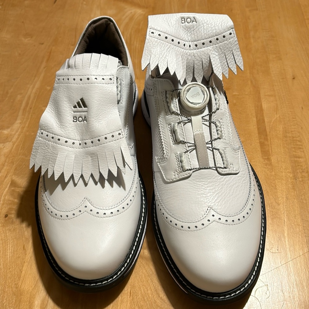 NWT adidas BOA golf shoes with classic fringe cover. Never been worn. Leather